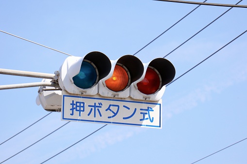A traffic light that reacts when a pedestrian presses a button.