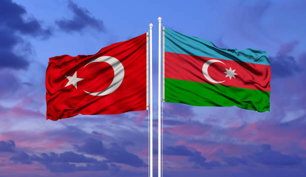 Azerbaijan and Turkey two flags on flagpoles and blue sky Azerbaijan and Turkey two flags on flagpoles and blue sky azerbaijan stock pictures, royalty-free photos & images