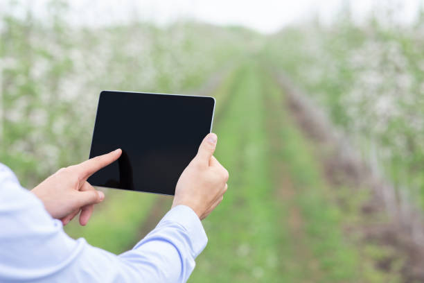 istock Farmer use tablet for control and monitoring on field 1309264022