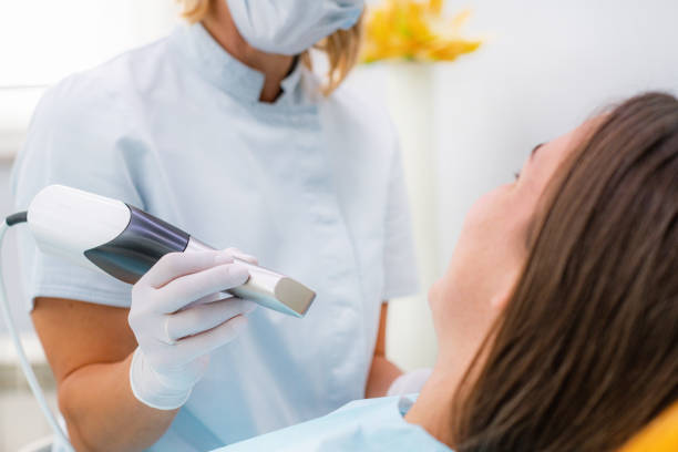 istock Prosthodontics - Dentist Using 3D Dental Camera for Scanning Teeth. 1309265306