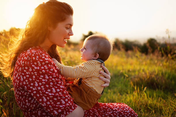 istock Happy mother talking to her baby son 1309266150