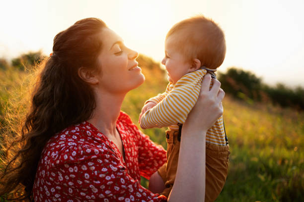istock Loving mother holding her baby boy 1309266155