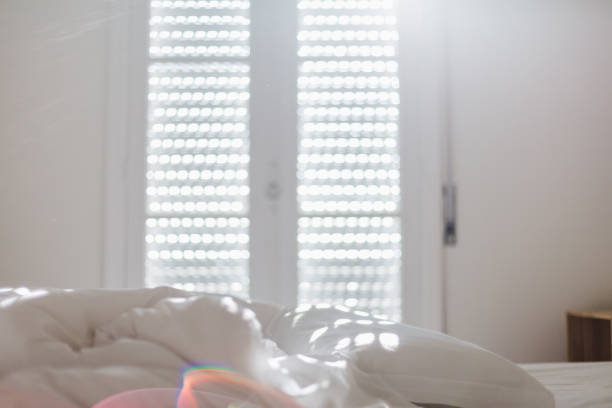 istock White bedding sheets and pillow in apartment at morning time with sunlight from windows 1309266232