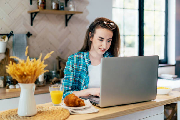 istock A real female freelancer uses a computer to work remotely and communicate from home. 1309266283