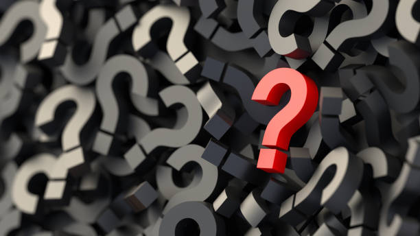 istock Red question mark on a background of black signs, FAQ Concept 1309266715
