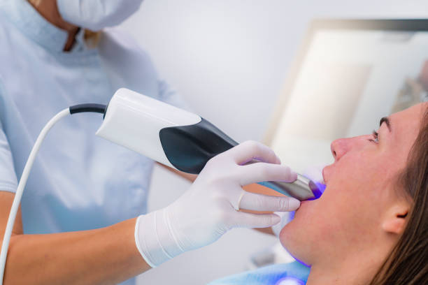istock Prosthodontics - Dentist Using 3D Dental Camera for Scanning Teeth. 1309270962