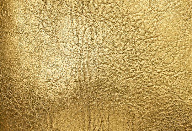 istock Gold wrinkled artificial leather texture background 1309275297