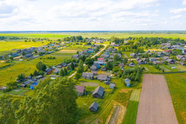 istock Russian village and plowed fields from above drone aerial view. 1309276715