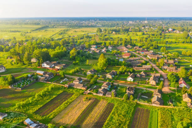 istock Russian village and plowed fields from above drone aerial view. 1309276732