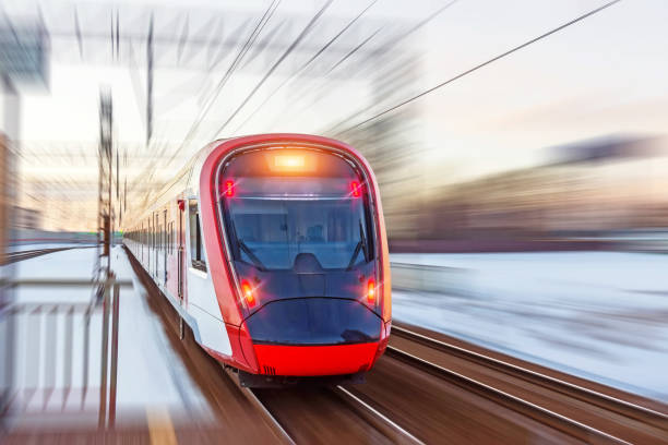 istock High speed modern commuter train red lights, motion blur. 1309276806