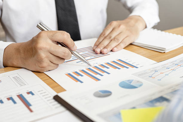 istock Finance staff is preparing company financial documents, data sheets in the form of charts as the company's financial, sales and expenditures to be brought into the meeting. Financial concept. 1309278011