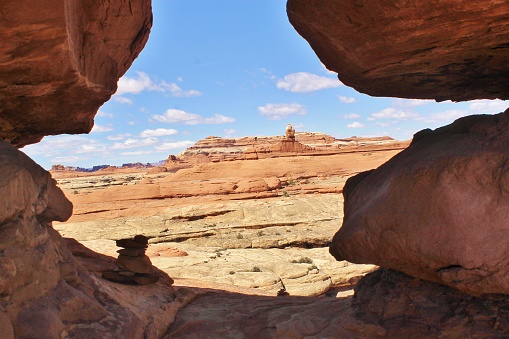 A natural arch window view of the desert canyons of the southwest