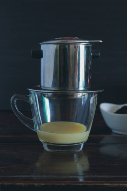 Sweetened condensed milk with hot coffee dripping in Vietnam style.