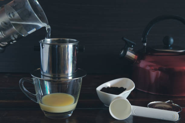 Sweetened condensed milk with hot coffee dripping in Vietnam style.