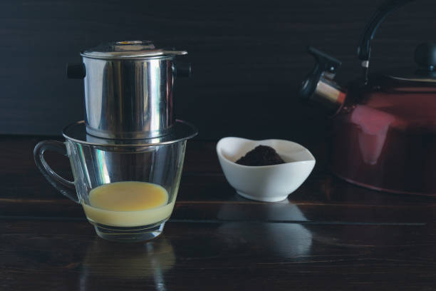 Sweetened condensed milk with hot coffee dripping in Vietnam style.