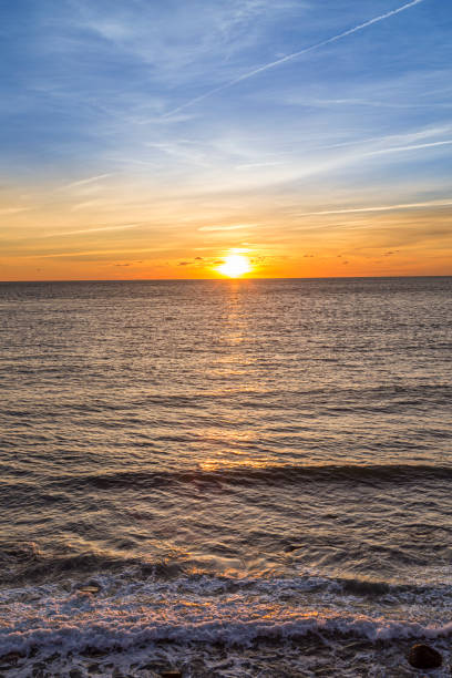 istock sunrise at Montauk point with soft waves 1309283003