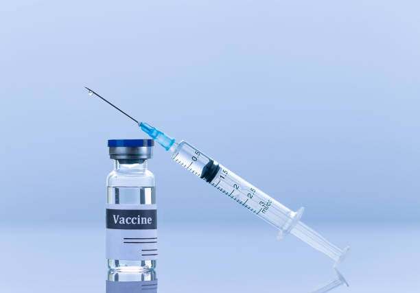 istock Vaccine vial and syringe with needle 1309283276