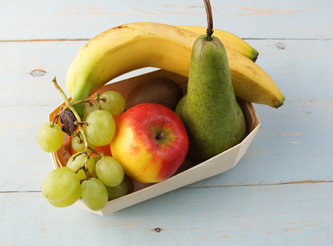 a small individual basket of fresh fruit