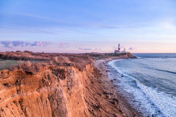 Montauk Point Light, Lighthouse, Long Island, New York, Suffolk County Atlantic ocean waves on the beach at Montauk Point Light, Lighthouse, Long Island, New York, Suffolk County the hamptons stock pictures, royalty-free photos & images