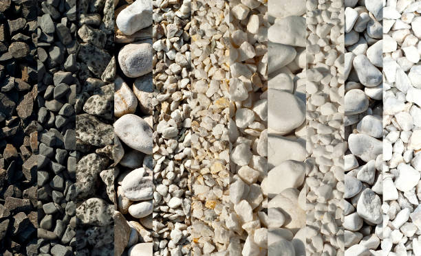 Detail of a Japanese zen garden with raked gravel,a rock and moss.