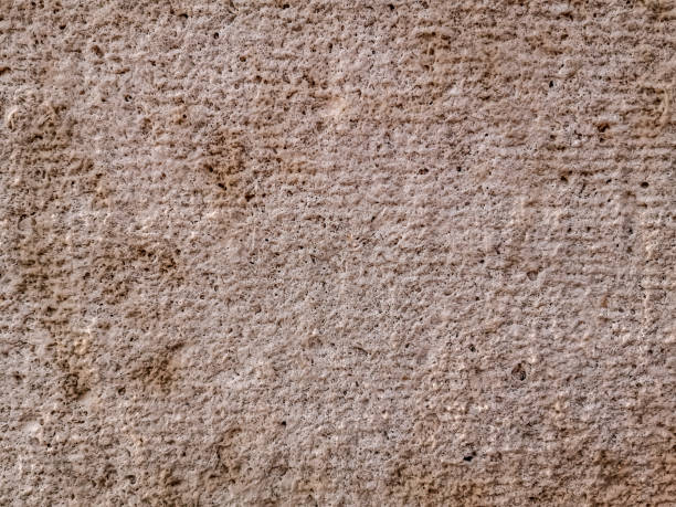 istock The porous rough surface of an ancient stone wall 1309284907