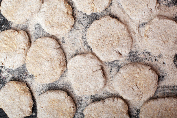 raw chicken cutlets in breadcrumbs on a plastic Board. cooking