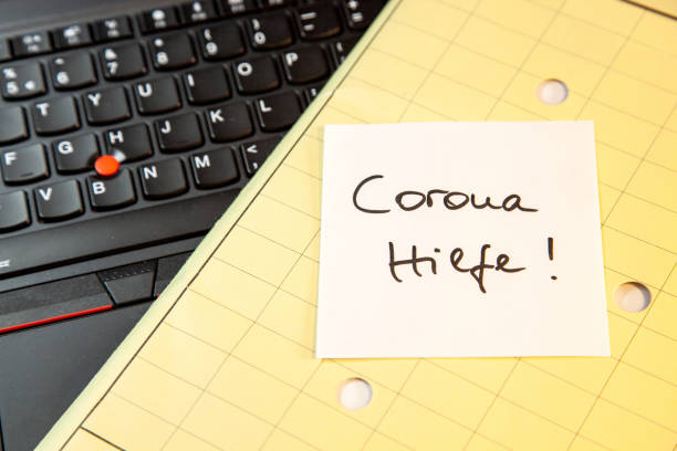 istock Laptop keyboard and green Folder with sticky note message, paper note Corona Hilfe - Help during the corona pandemic 1309289247