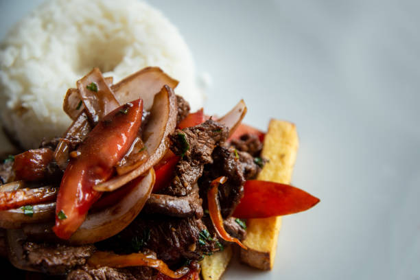 istock Peruvian Food - Lomo Saltado (South American Food - Meat - Rice) 1309289653