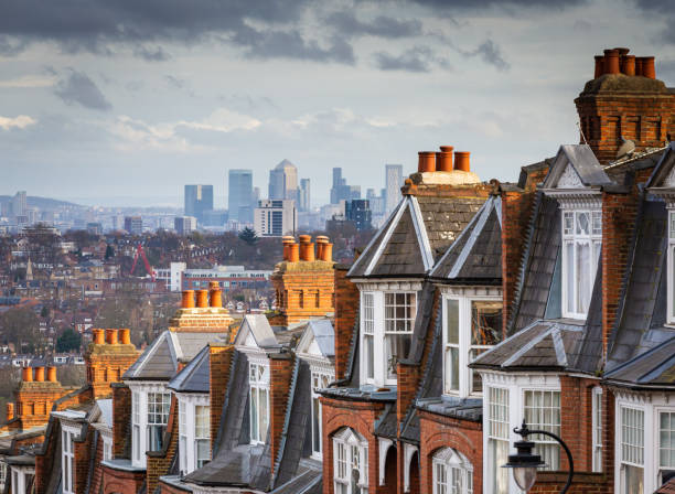 View across city of London from Muswell Hill The red brick Victorian row houses of Muswell Hill with panoramic views across to the skyscrapers and financial district of the city of London. row house photos stock pictures, royalty-free photos & images