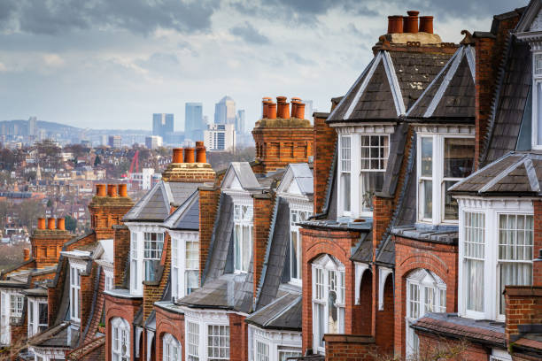 View across city of London from Muswell Hill The red brick Victorian row houses of Muswell Hill with panoramic views across to the skyscrapers and financial district of the city of London. window chimney london england residential district stock pictures, royalty-free photos & images