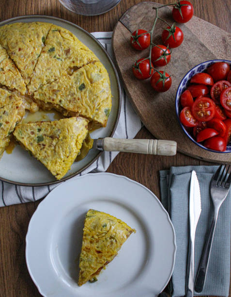 istock Title: Tortilla pincho. Plated Spanish potato omelette pintxo on a set table. 1309290329