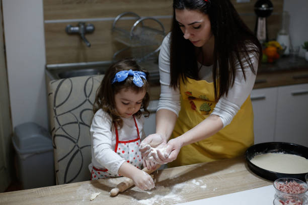 istock Family making pizza.stock photo 1309290440