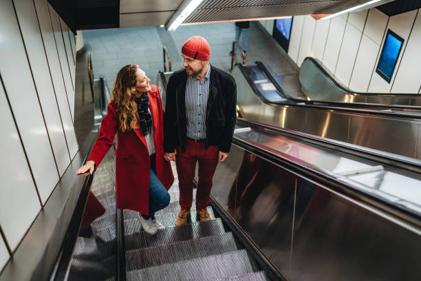istock Couple in love on subway escalator 1309291424