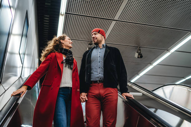 istock Couple in love on subway escalator 1309291515