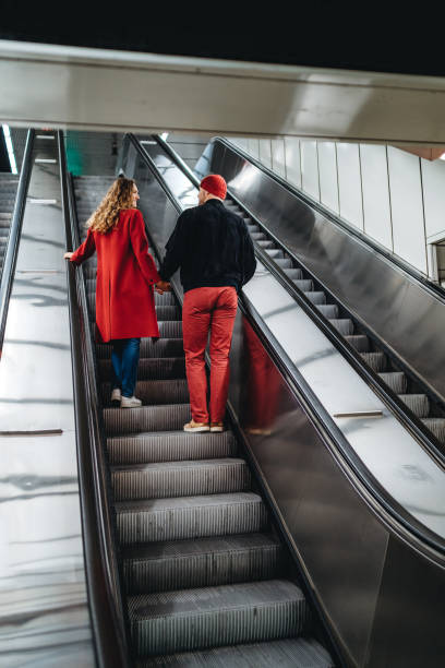 istock Couple in love on subway escalator 1309291532