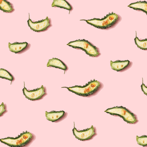 istock Slices of bitter melon random on pastel pink. Flat lay arrangement. 1309291717
