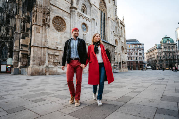 istock Happy couple walking over town square in Vienna 1309291870