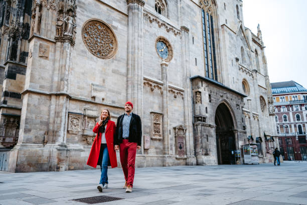 istock Happy couple walking over town square in Vienna 1309291895