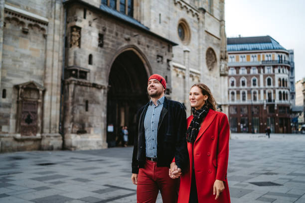istock Happy couple walking over town square in Vienna 1309292451