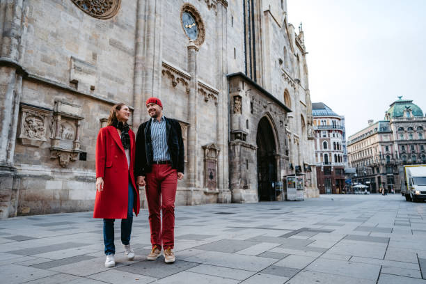 istock Happy couple walking over town square in Vienna 1309292470