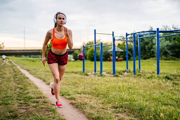 istock Sportswoman running in nature 1309293608