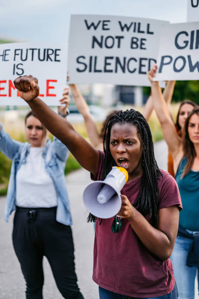 istock Women protesting for equality and women rights 1309296125