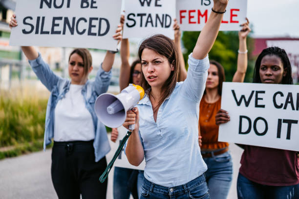 istock Women protesting for equality and women rights 1309296143