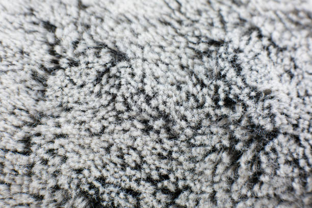 istock Grey cotton towel or carpet fluffy texture background. Close up, macro photo. Soft focus image. 1309297253