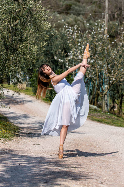 istock dancer posing on the gravel road 1309298193