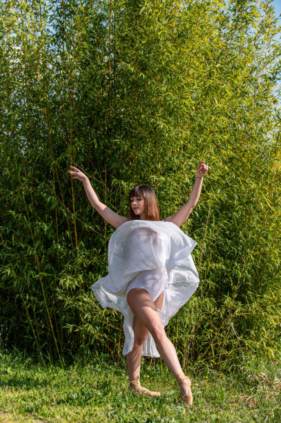 istock dancer in various poses in the environment of nature 1309298198