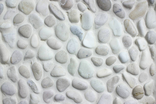 istock White small stones texture background, cladding tiled bathroom walls. 1309298374