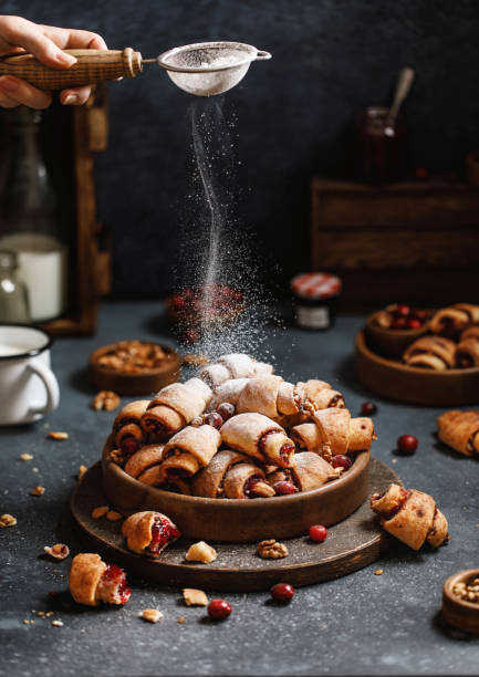 istock Cottage cheese croissant with walnuts on grey background 1309300496