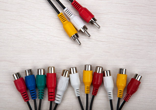 istock colored audio wires tulips on wooden background top view 1309300806