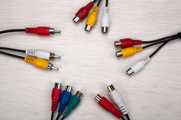 istock colored audio wires tulips on wooden background top view 1309300815
